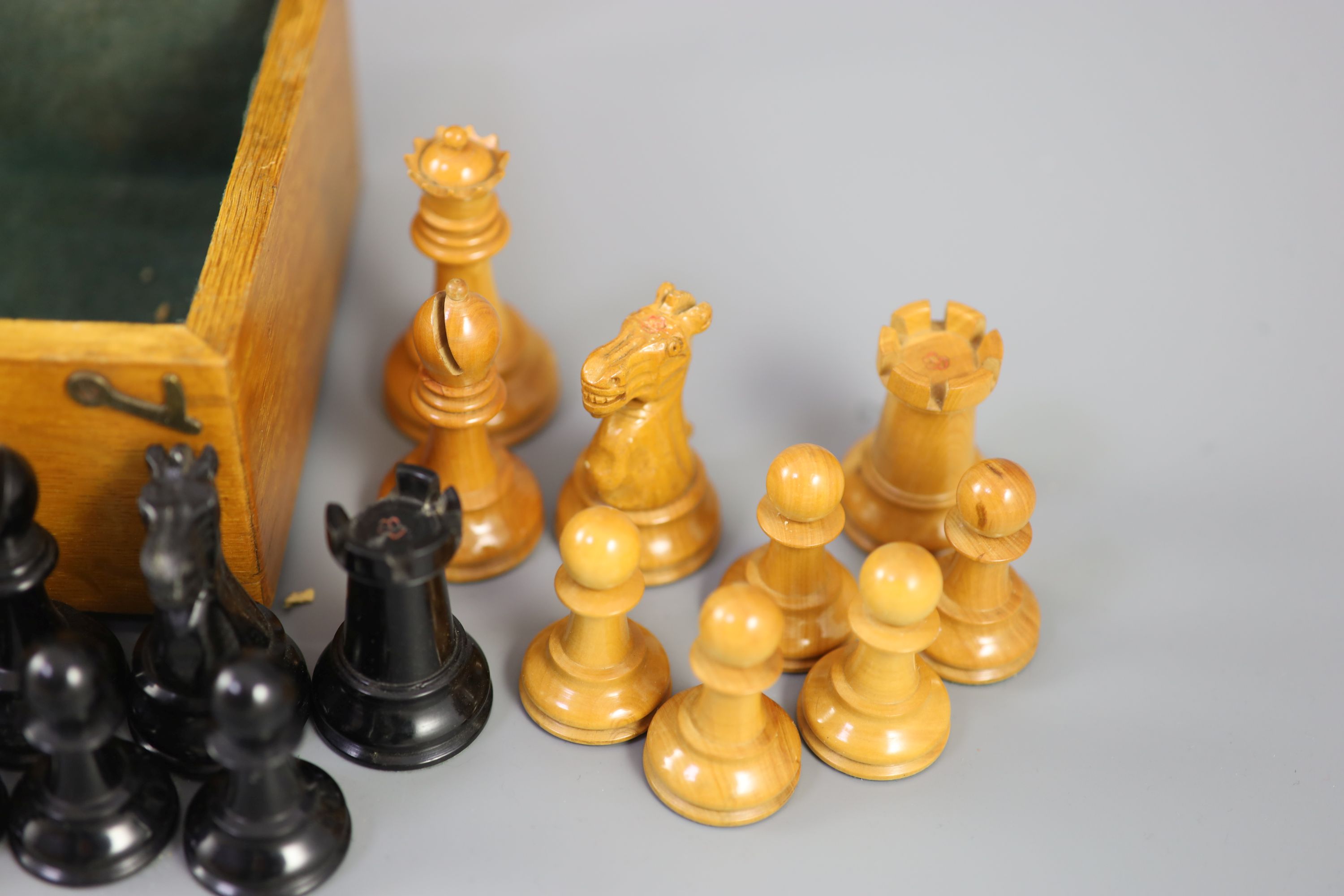 A Jaques & Son Staunton 3 1/2 boxwood and weighted chess set in original golden oak box, c.1910, 8 x 5.75 x 3.5in.